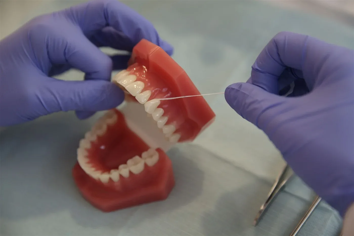 How do you use dental floss properly, and what mistakes are common?